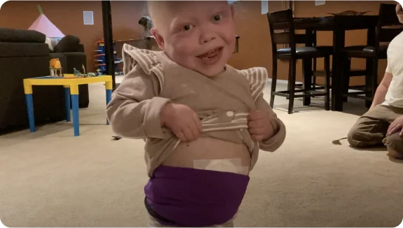 a child holding a toy sword