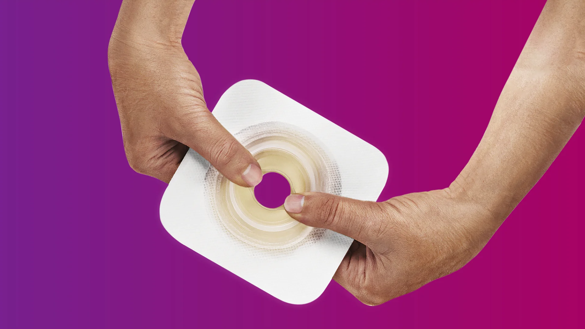 hands holding an adhesive