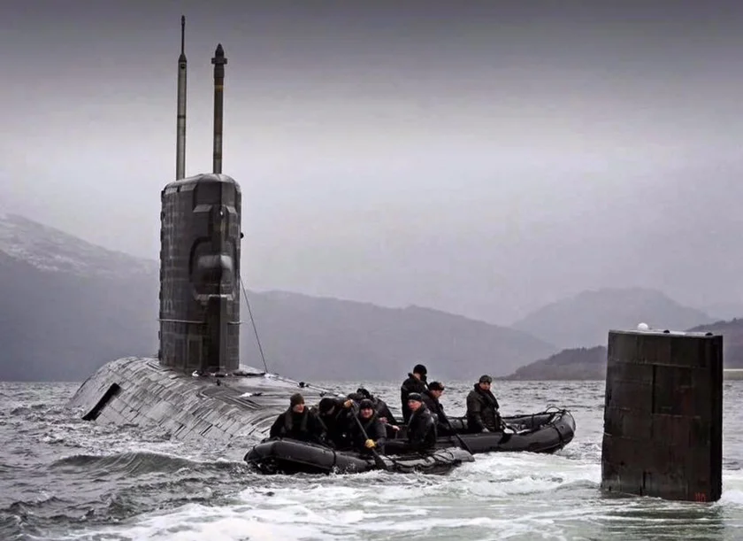 members of the British royal navy on a submarine 