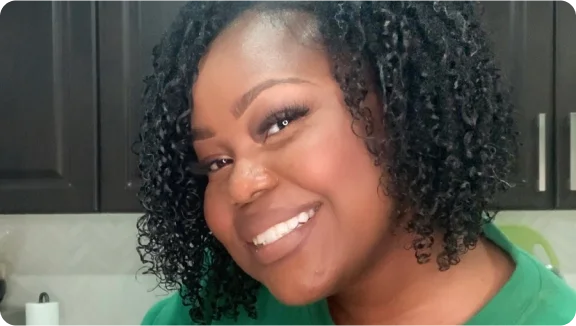 a woman with curly hair