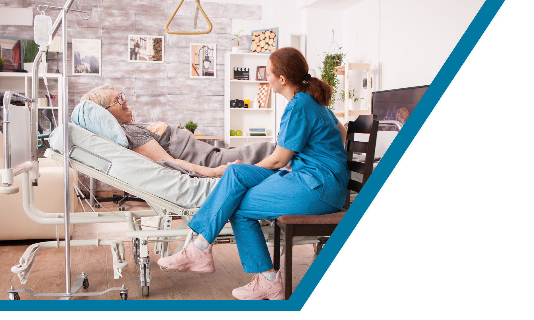 a woman sitting on a chair next to a man in a hospital bed
